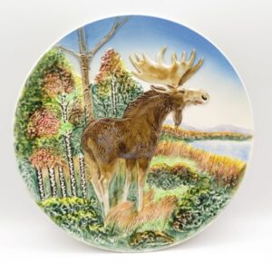 ceramic decorative plate with a moose on it
